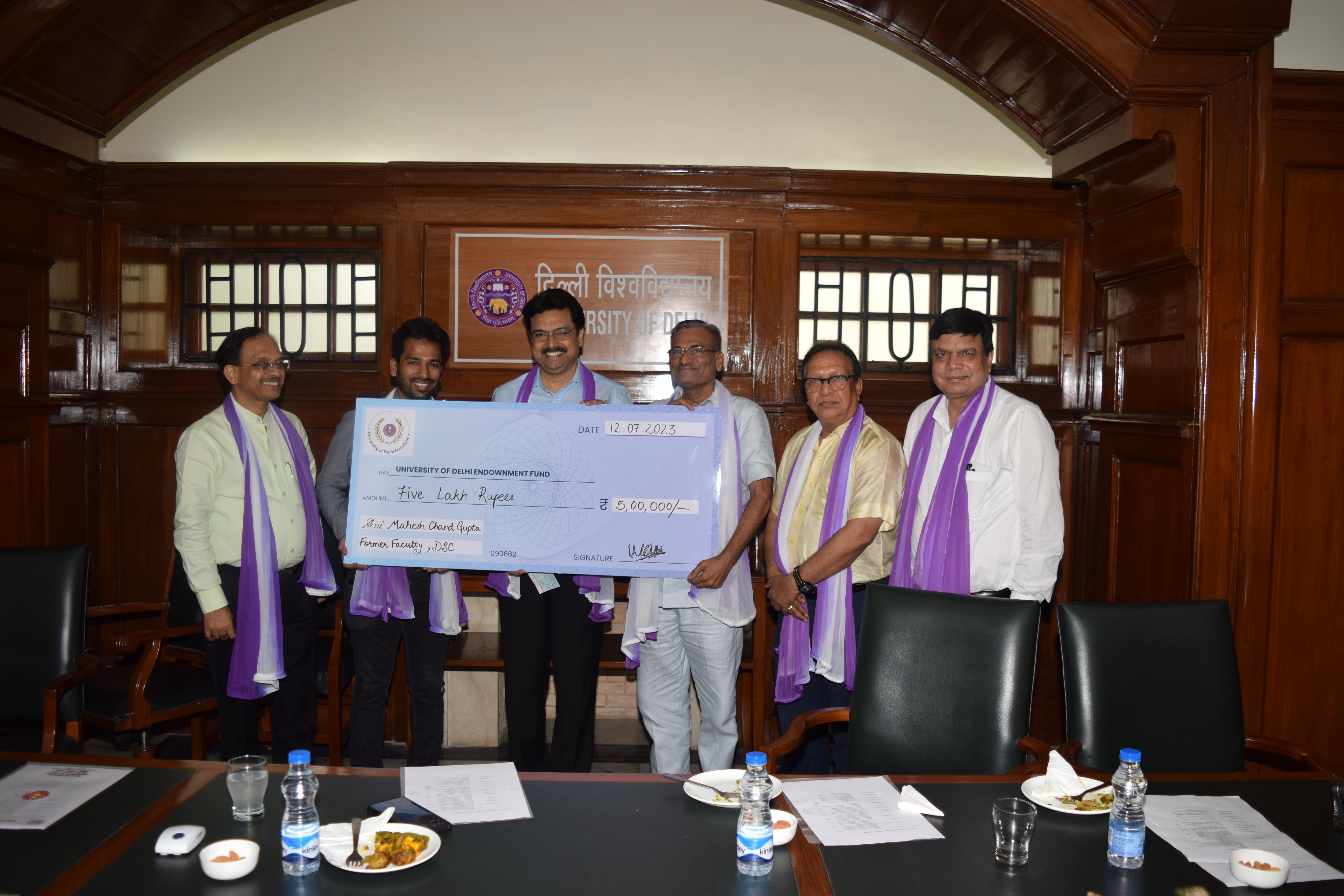 Prof. Mahesh Chand Gupta donating at the Vice Regal Lodge